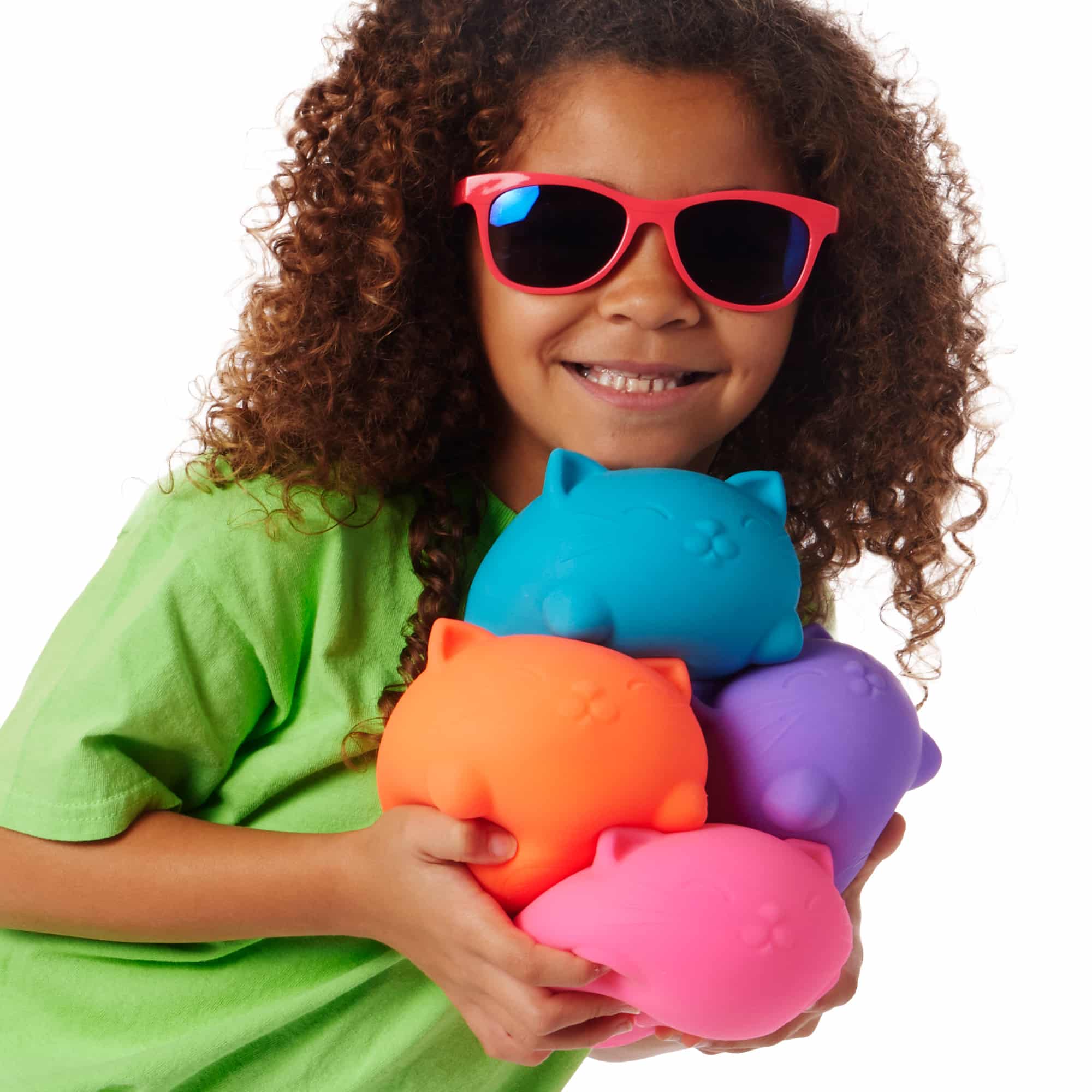 NeeDoh Super Cool Cats S3 - Lifestyle with girl holding all four colors Super Cool Cats S3
