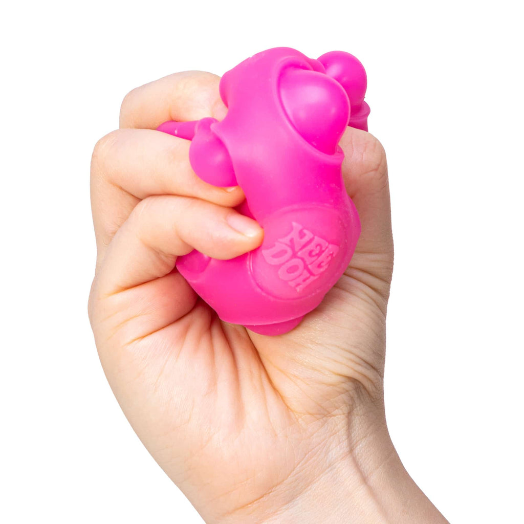 NeeDoh Happy Snappy B2 - Hand squeezing pink Happy Snappy B2