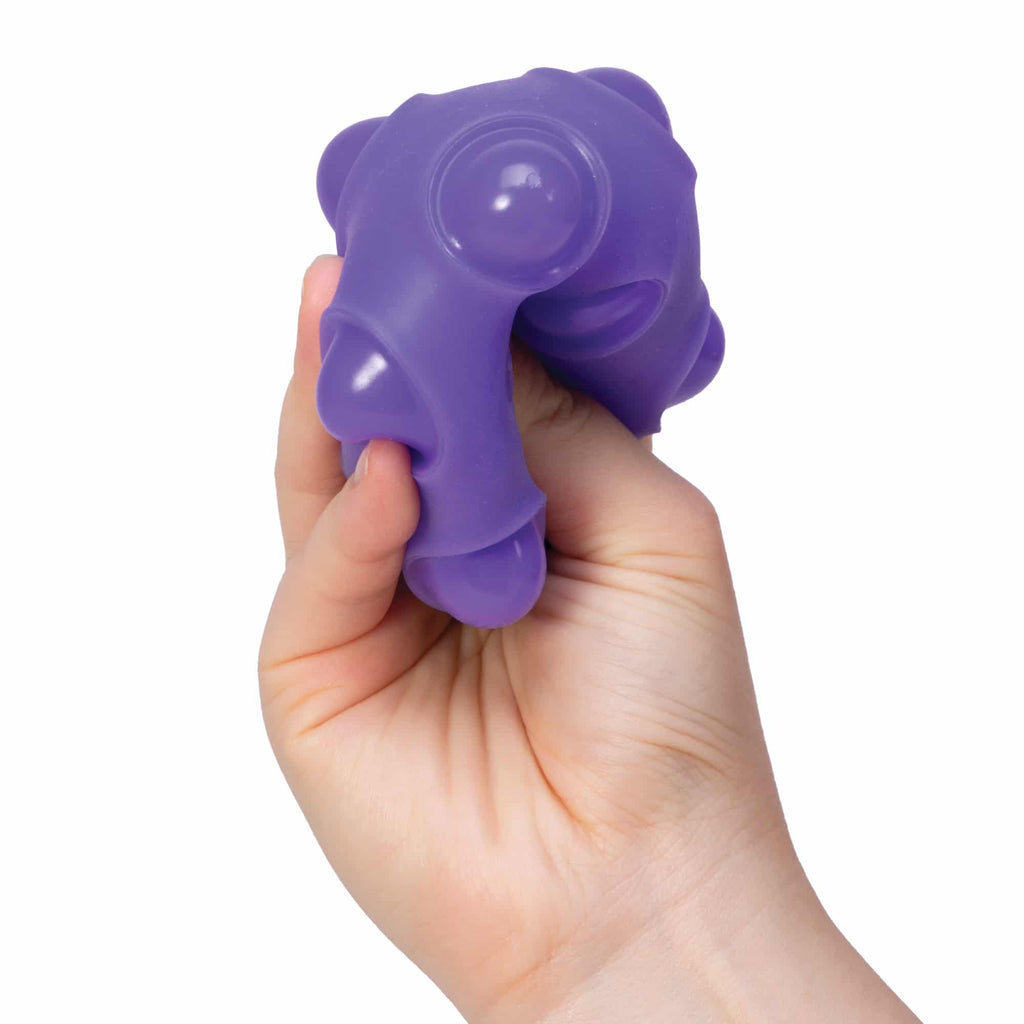 NeeDoh Happy Snappy B2 - Hand squeezing purple Happy Snappy B2