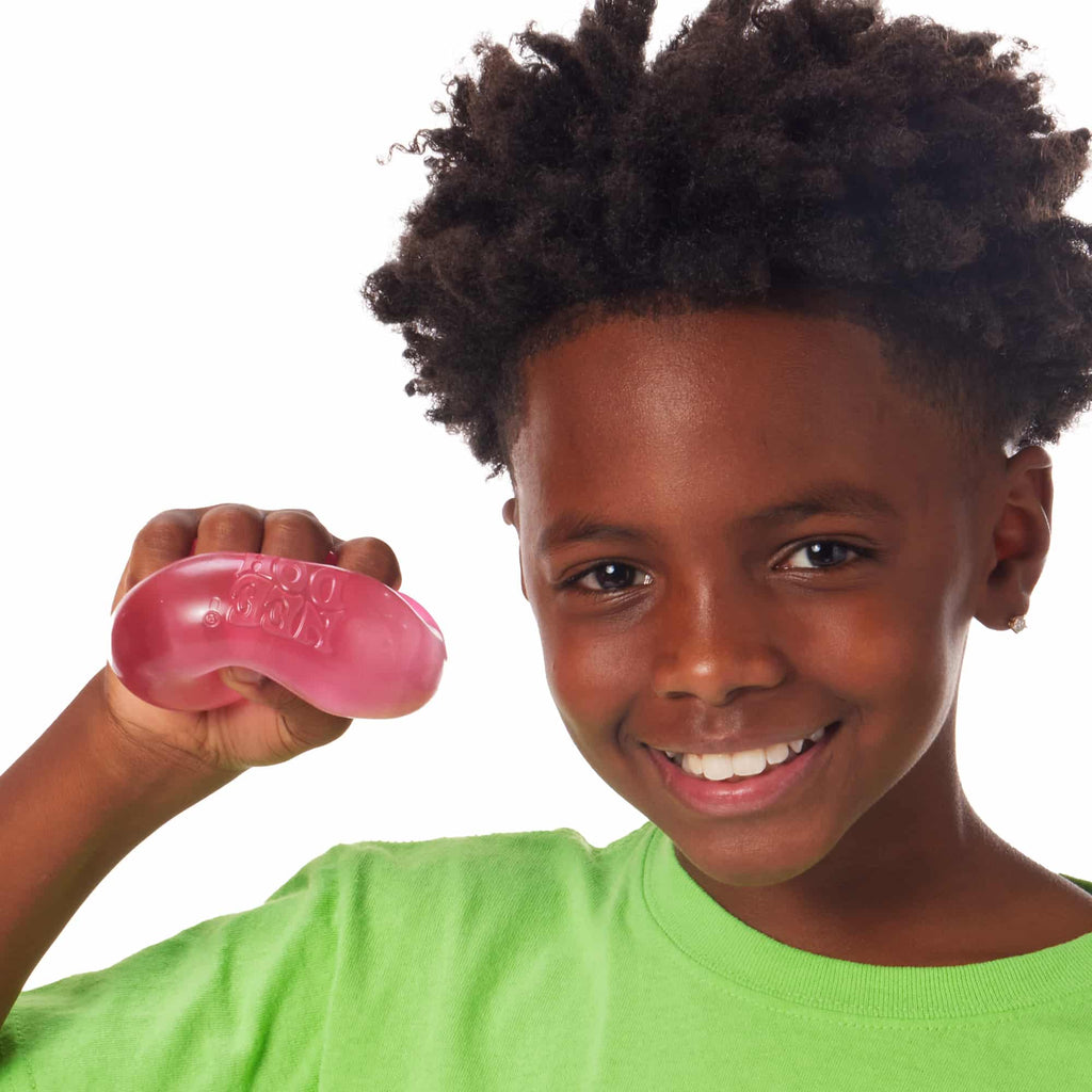 NeeDoh Nice Cube X2 Lifestyle of boy squeezing pink Nice Cube X2