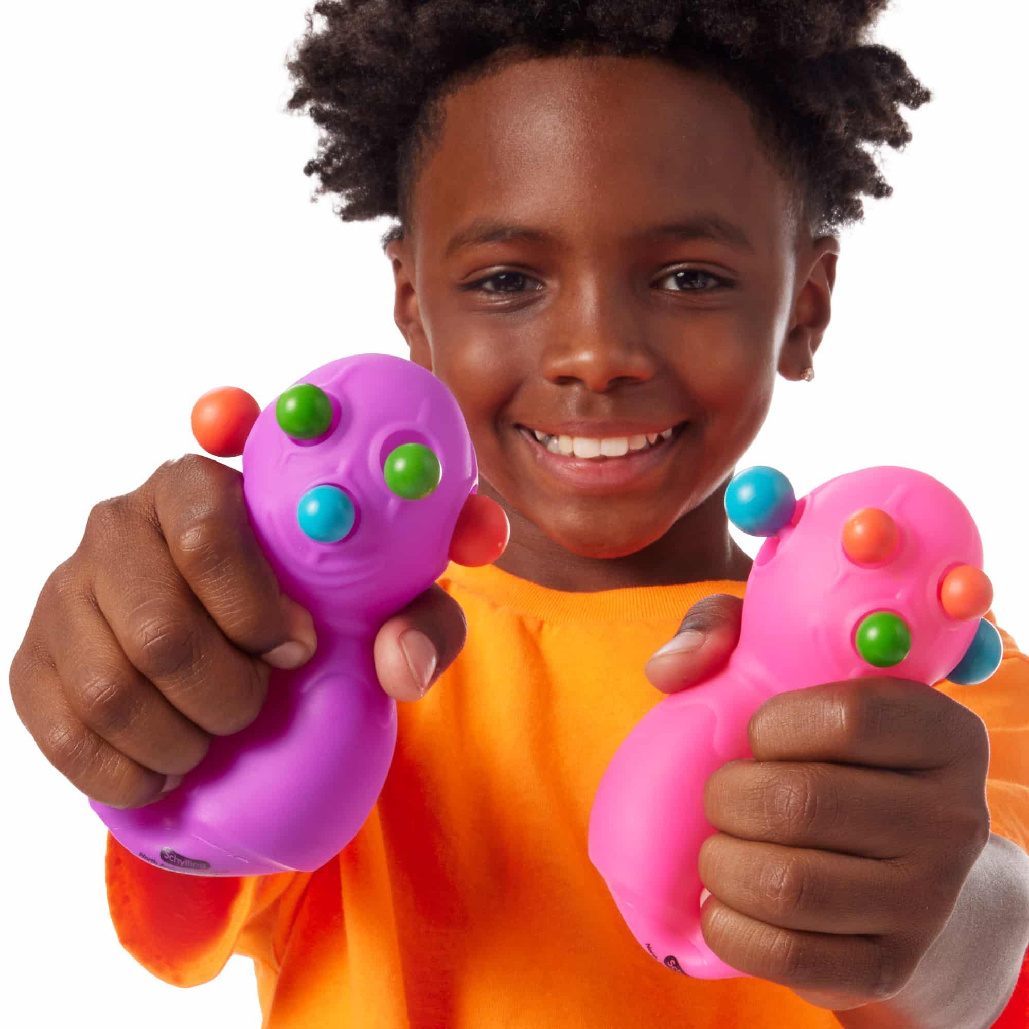 NeeDoh Panic Pete M4 Lifestyle with boy squeezing purple and pink Panic Pete M4s