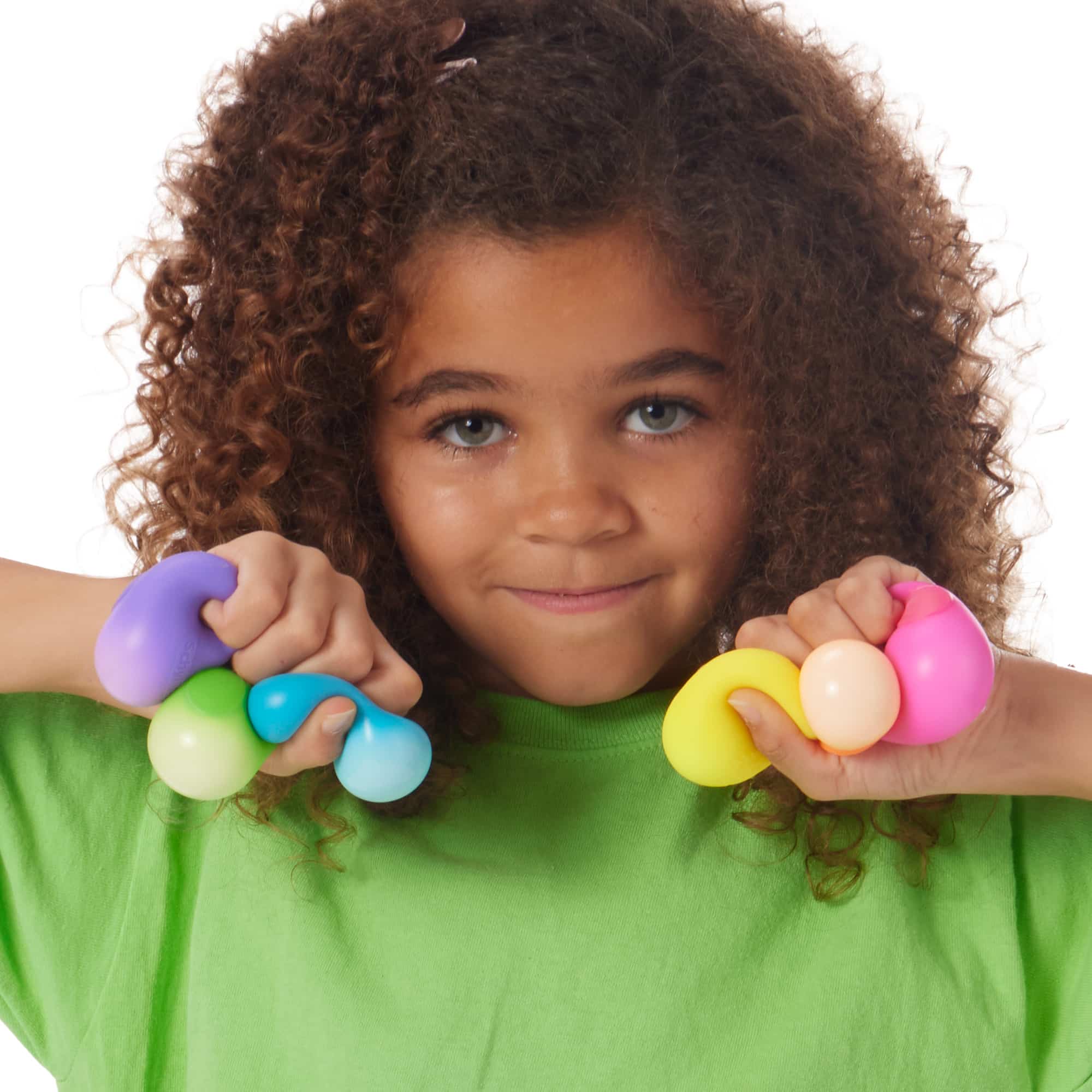 Girl squeezing 6 Rainboh Q3 Teenie NeeDoh